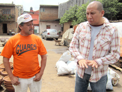 Dirceu Aguila (right) trains rural Mexican artisans how to produce lead-free pottery.