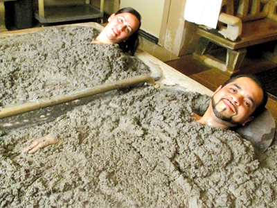 For health benefits or just relaxation, more Hispanics are experiencing spa treatments like this hot mud bath in Calistoga.